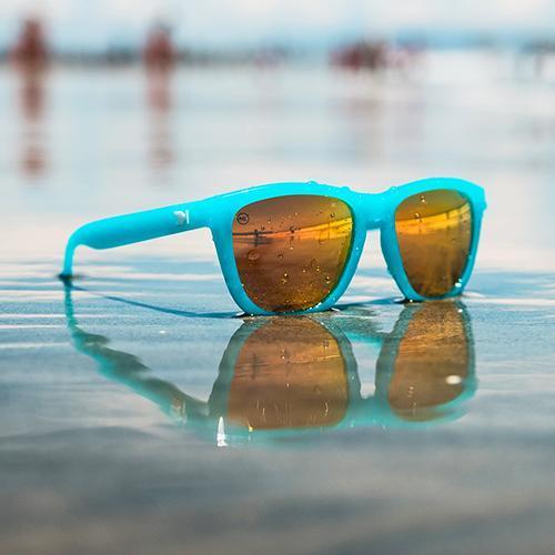 Polarized sunglasses by the water