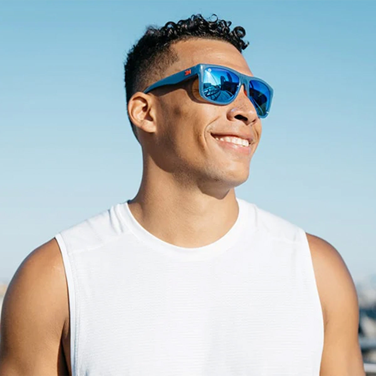 Man wearing Knockaround Victory Lap Torrey Pines Sports Sunglasses
