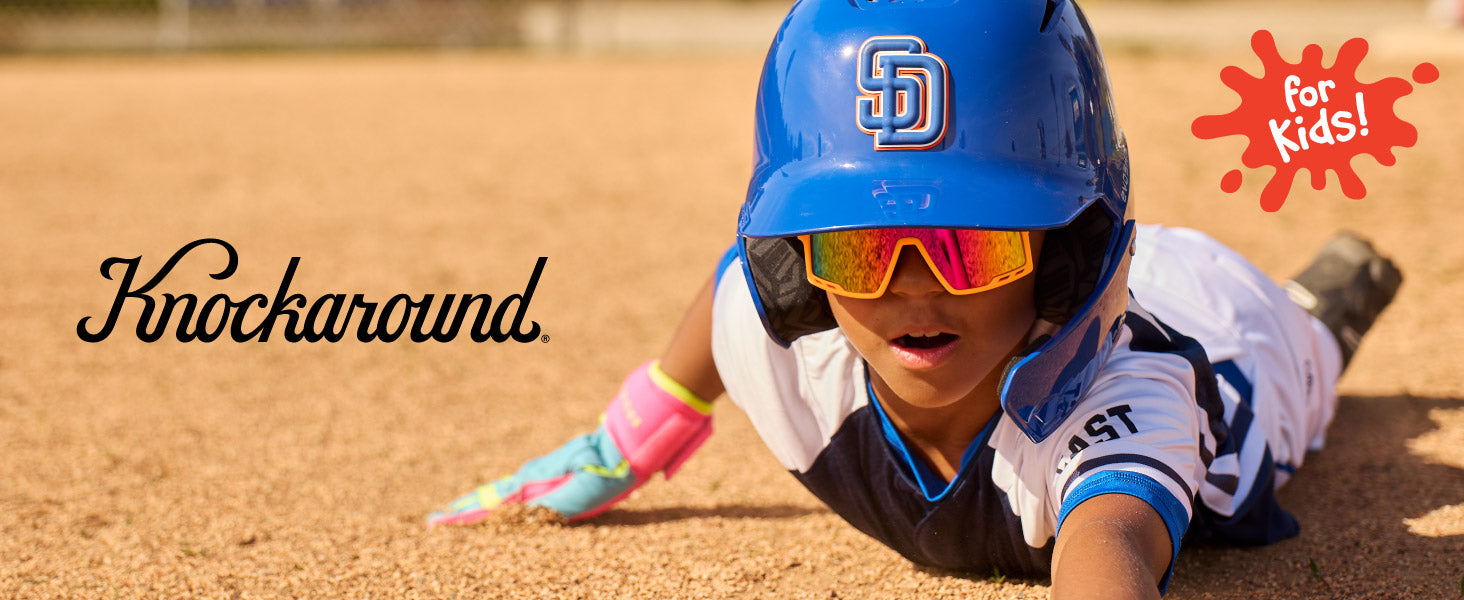 Kids Campeones Knockaround Sunglasses. Photo features a boy wearing Kids Campeones sunglasses.