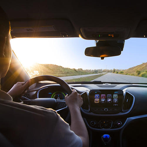 View through windshield of man driving a car