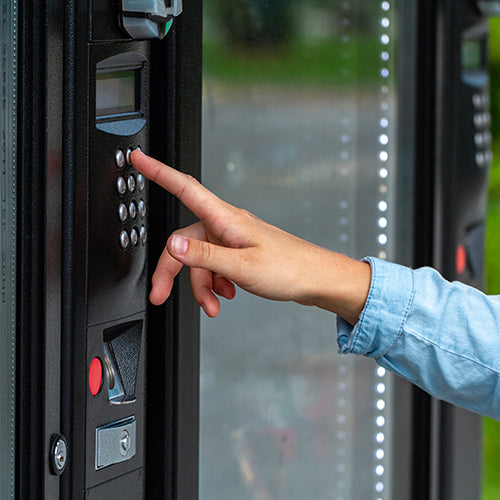 Hand buying food from a vending machine