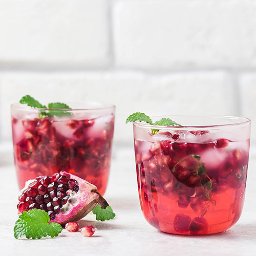 Two pomegranate kombucha cocktails