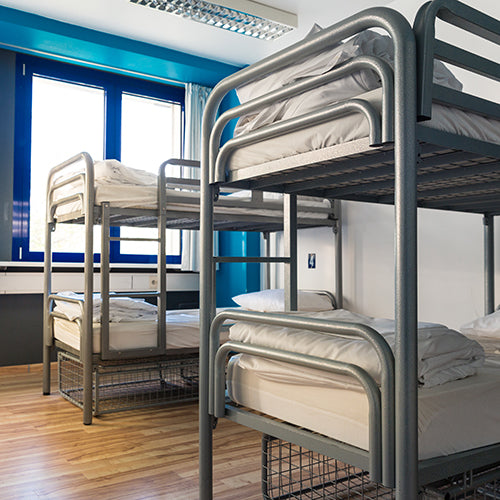 Hostel interior with a set of bunk beds