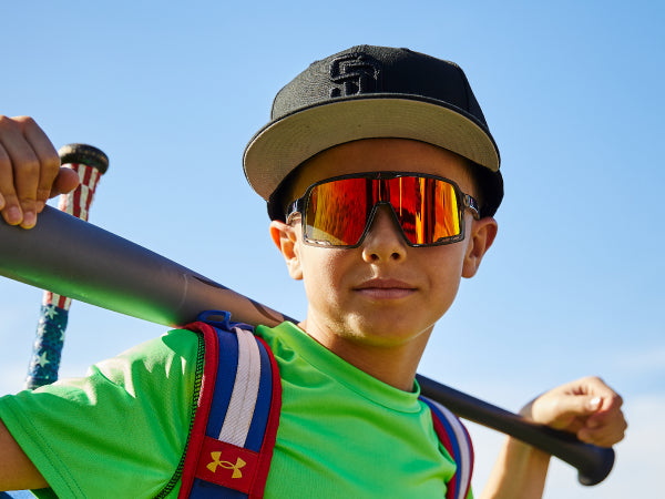 Boy wearing Knockaround sunglasses