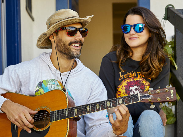 Man and Woman wearing Knockaround sunglasses