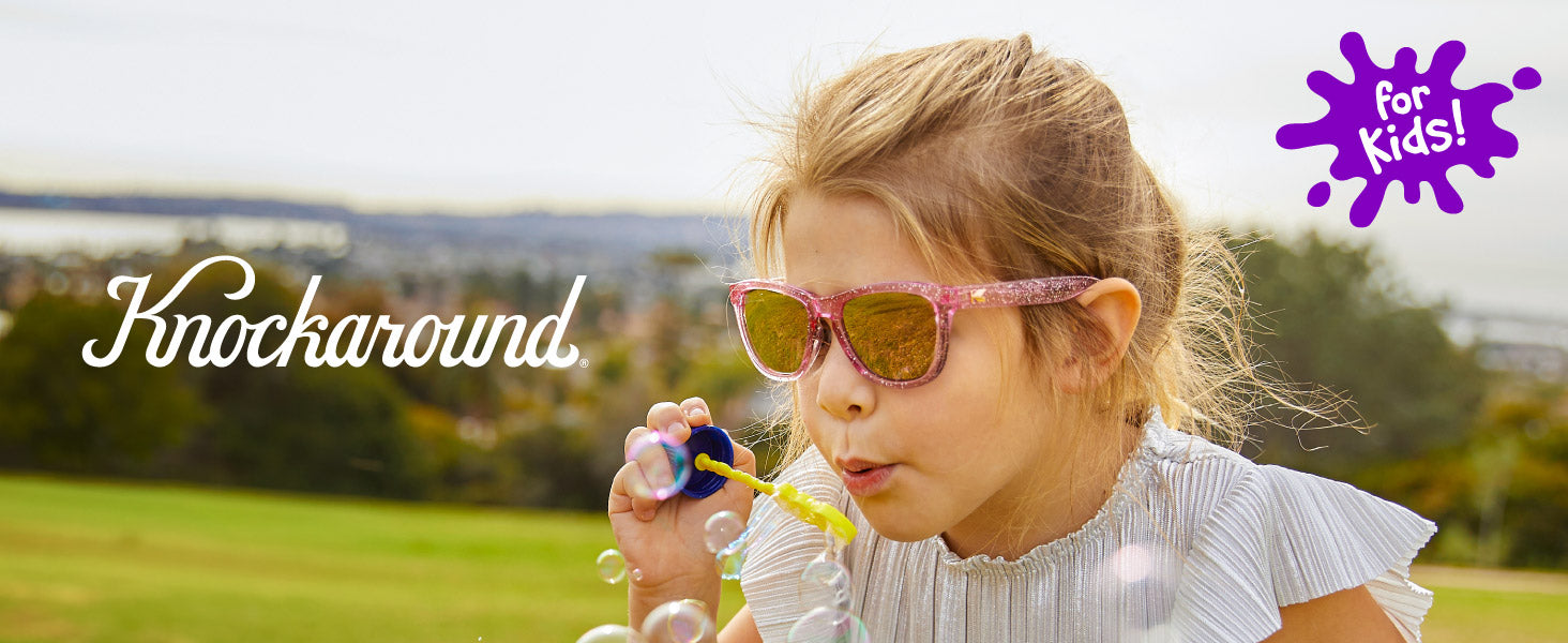 Kids Premiums Knockaround Sunglasses. Photo features a girl wearing Kids Premiums sunglasses. 